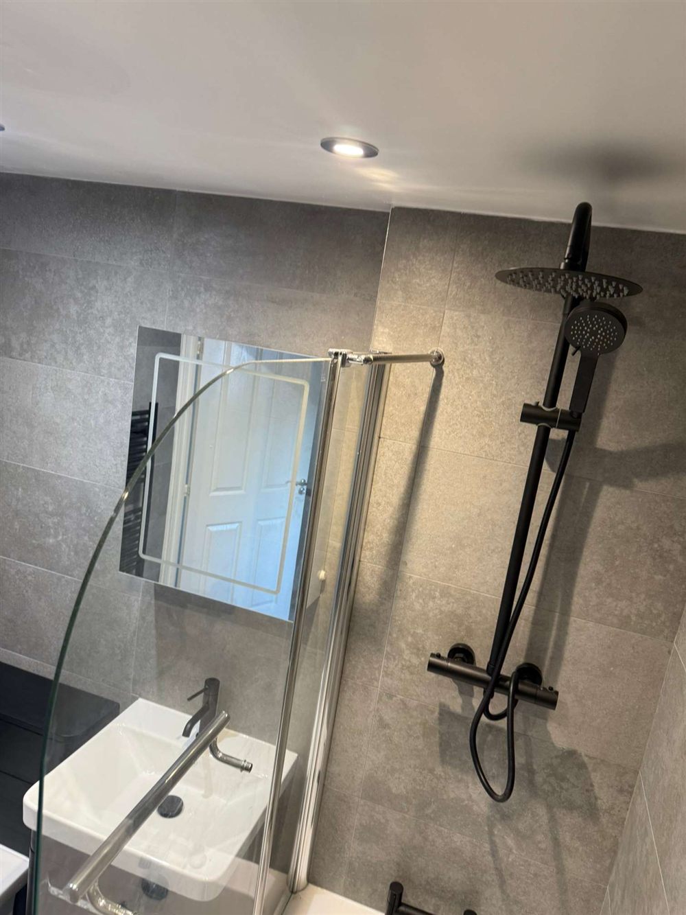 Shower with LED mirror and rainfall head