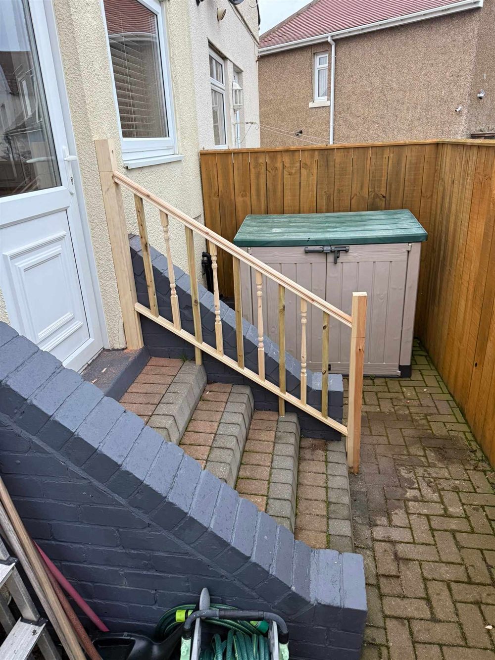 Garden steps with timber handrail and storage area